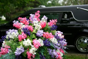 Lesson in Contrasts - Vibrant flowers and Funeral Hearse
